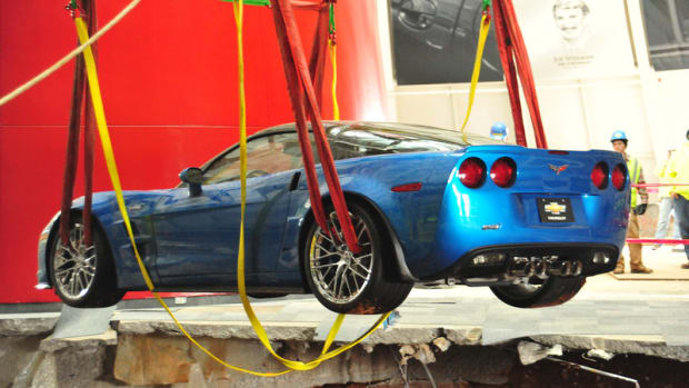 The Corvette ZR1 Blue Devil being lifted out of the sinkhole Monday, March 3. The car was started and driven under its own power after it was retrieved.