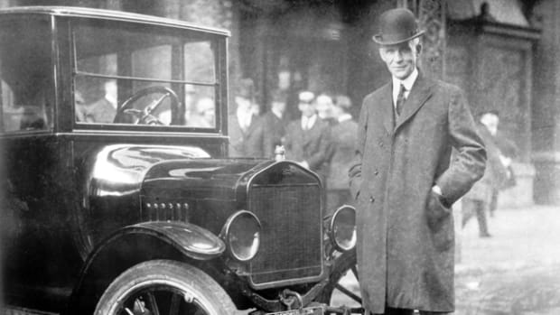 Henry Ford with the car that made him a household name, the Model T.