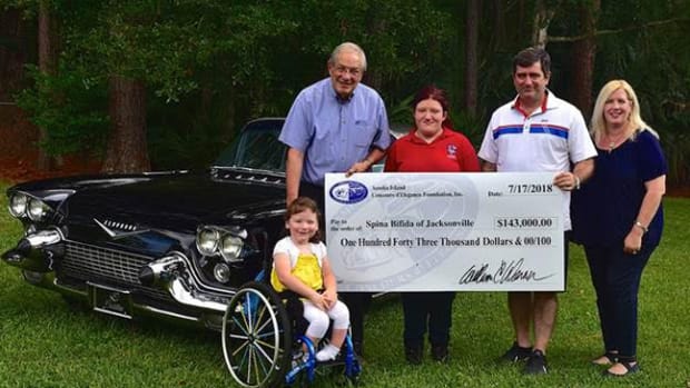  The Amelia’s Founder and Chairman, Bill Warner (top left), and Executive Director, Brian Webber (second from right), present the Executive Director of Spina Bifida of Jacksonville, Demery Webber (far right), with a check for $143,000.