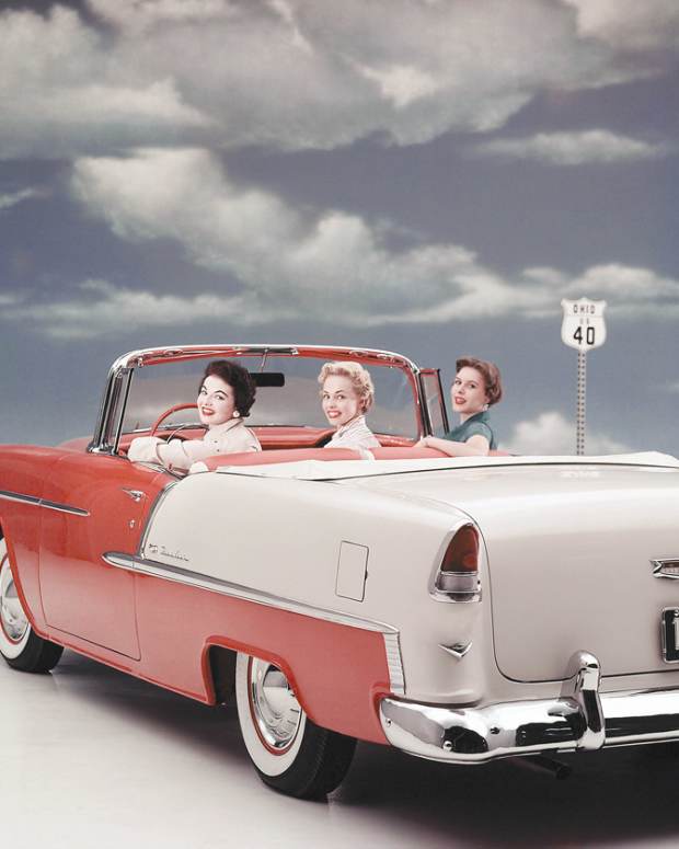 This promotional photo of a 1955 Bel Air convertible not only shows the car’s all-new styling, but suggests it comfortably sits three side-by-side. It also clearly shows the Gypsy Red and India Ivory two-tone paint scheme, one of many possible two-tone possibilities offered for the Bel Air. Note the “V” emblem under each taillamp indicating the car was equipped with one of the optional small-block 265-cid V-8s. 