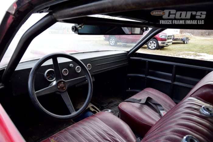 Notice the custom, hand-fabricated instrument panel with aftermarket gauges and larger steering wheel. The Hurst shifter was removed by the owner as a security measure.