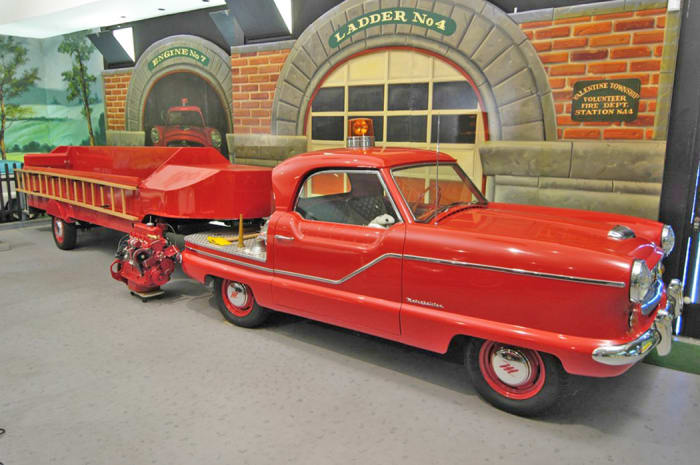 1957 Met fire chief car with ladder wagon.