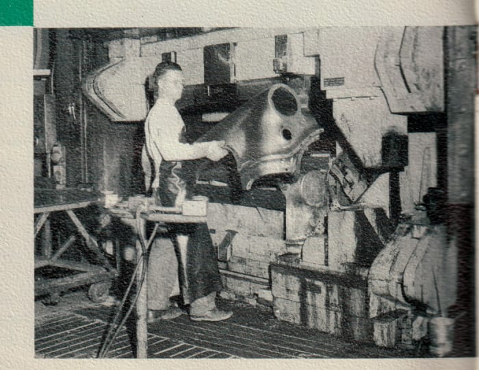 After the “Rocket” Engine plant tour, Oldsmobile took visitors to the Pressed Metal Plant, where “new ‘Rocket’ Oldsmobiles take shape.” A lineup of 246 presses were used to blank, draw, restrike and trim sheets of 19-gage steel to form the body panels. Pictured are formed “sweep-cut fenders” for new “98” and “88” models.