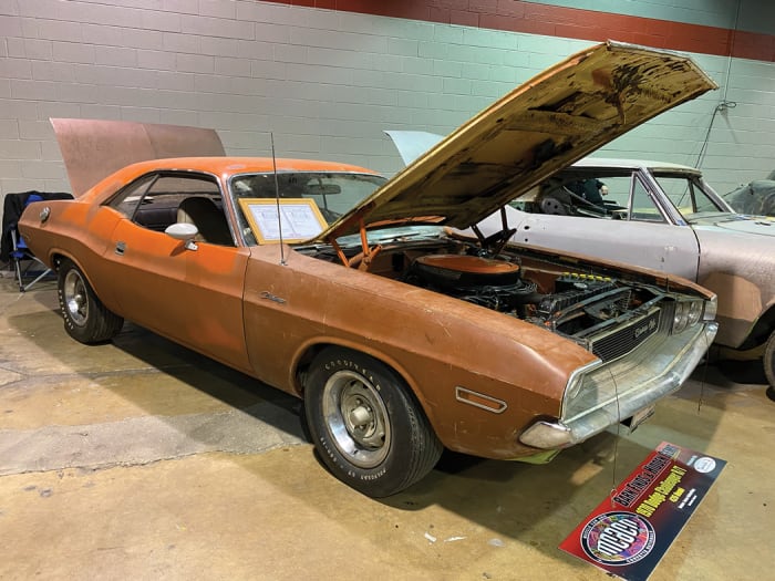 A yet-to-be-restored 1970 Dodge Challenger R/T packing Hemi power and faded Go Mango or Hemi Orange paint on some of its panels. Jesse Heberling is the owner of this super-desirable Dodge pony car.