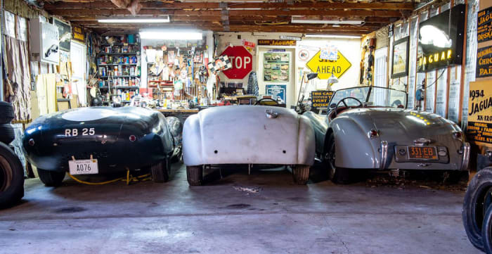 The Hendricks Collection as found after two decades hidden away, L-R, Costin-bodied 1959 Lister Sports Racing Car; ‘LT3’ 1951 Jaguar Works-built lightweight aluminum racing XK120; 1954 Jaguar XK120M Roadster.