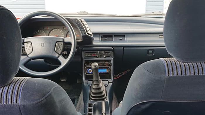 The Isuzu Impulse XS Wagonback interior is compact and typical of the early 1990s, and was better trimmed than GM’s similar Geo model.