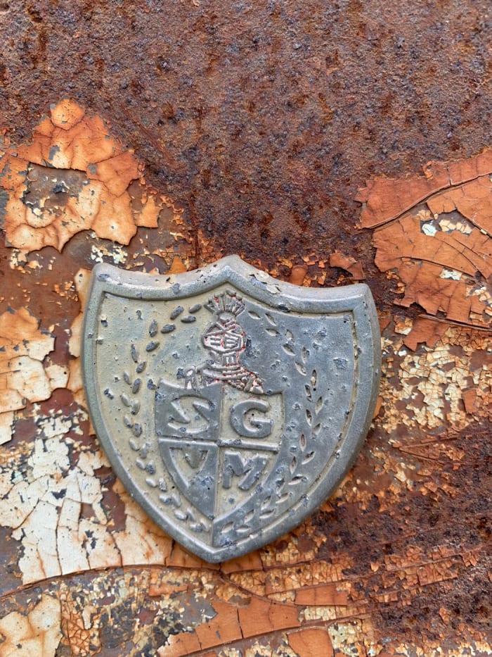There aren’t believed to be any unique exterior trim parts to identify the Mardi Gras. This shield found on the car’s exterior, beneath its trunk lid, is believed to have been added by the dealer that mounted the continental kit for the original owner.