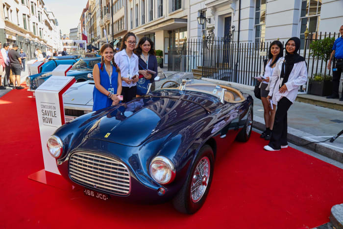 Young Londoners of the Hagerty Youth Judging Program aged between 13 and 17 from the Westminster City Lions chose the best three cars in the Concours on Savile Row. They are seen here with Best of Show 1950 1950 Ferrari 166MM Barchetta.