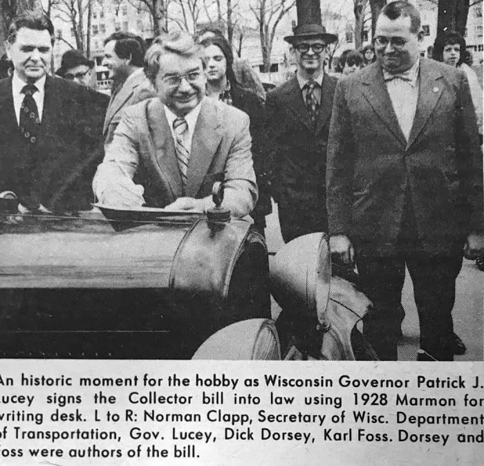 Wisconsin Governor Patrick J. Lucey signs the state’s Collector bill into law on May 3, 1972, using a 1928 Marmon as a writing desk. Pictured from left to right are Norman Clapp, secretary of the Wisconsin Department of Transportation in 1972; Gov. Lucey; Dick Dorsey; and Karl Foss.