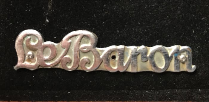 LeBaron script-type tag of the type used after 1933 (right) sold for $80 in an online auction by Check the Oil Promotions.