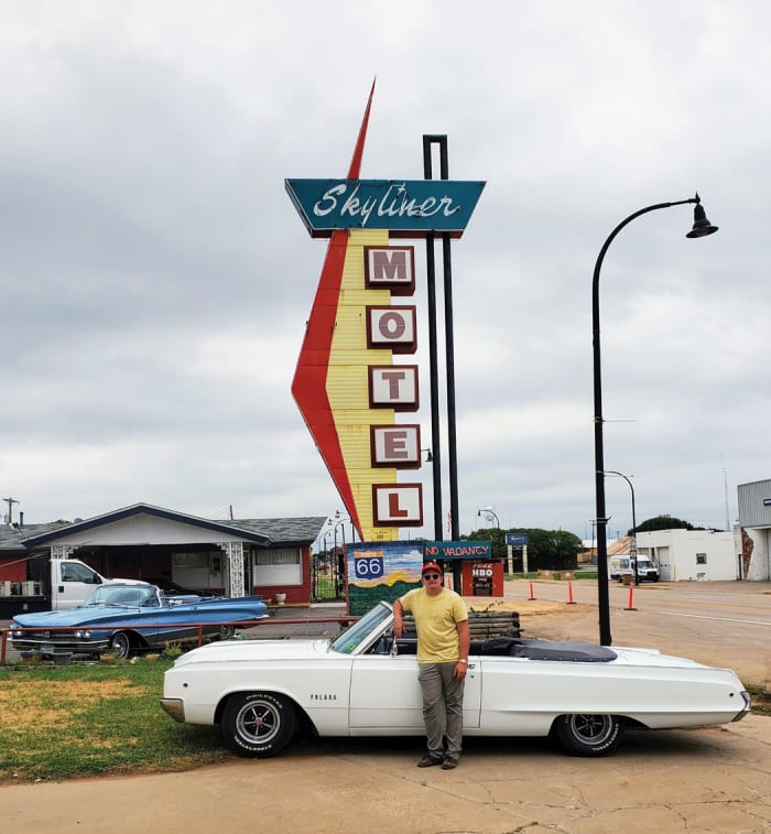 Ryan with the top down on his 1968 Dodge Polara convertible outside the Skyliner Motel in Stroud, Okla.