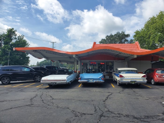 Jim, Ryan and their friend Jon, who owns the 1959 Mercury at right, secured three adjacent spots beneath the wacky wavy roof of the 1962 A&W root beer stand in Dexter, Mich.