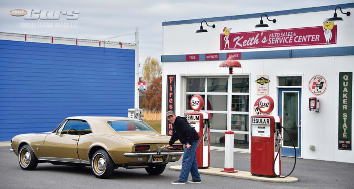 McGregor Long, aka “McG,” simulating the process of putting premium fuel into Jenny the Camaro at Camp Light in Waynesboro, Va. McG is a longtime student at Camp Light, the location of the recreated Keith’s Auto Sales & Service Center backdrop for Jenny.