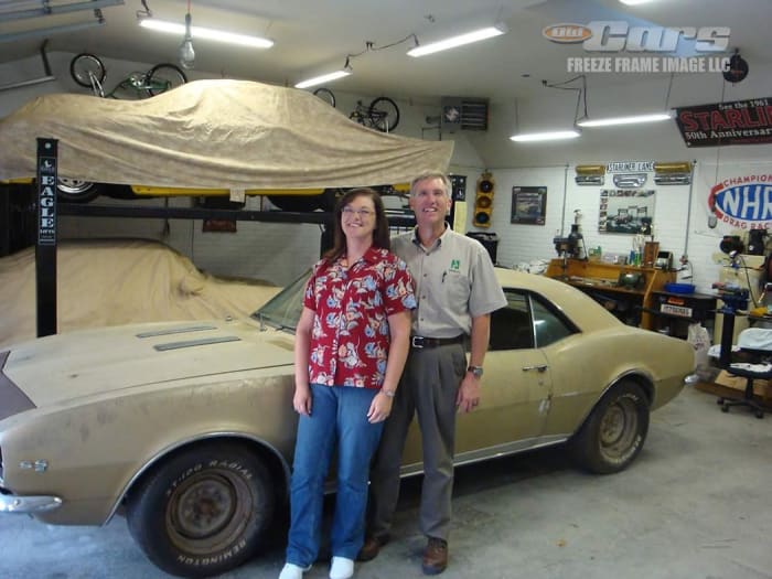 Zach and Brenda Straight with Jenny the Camaro prior to the restoration.