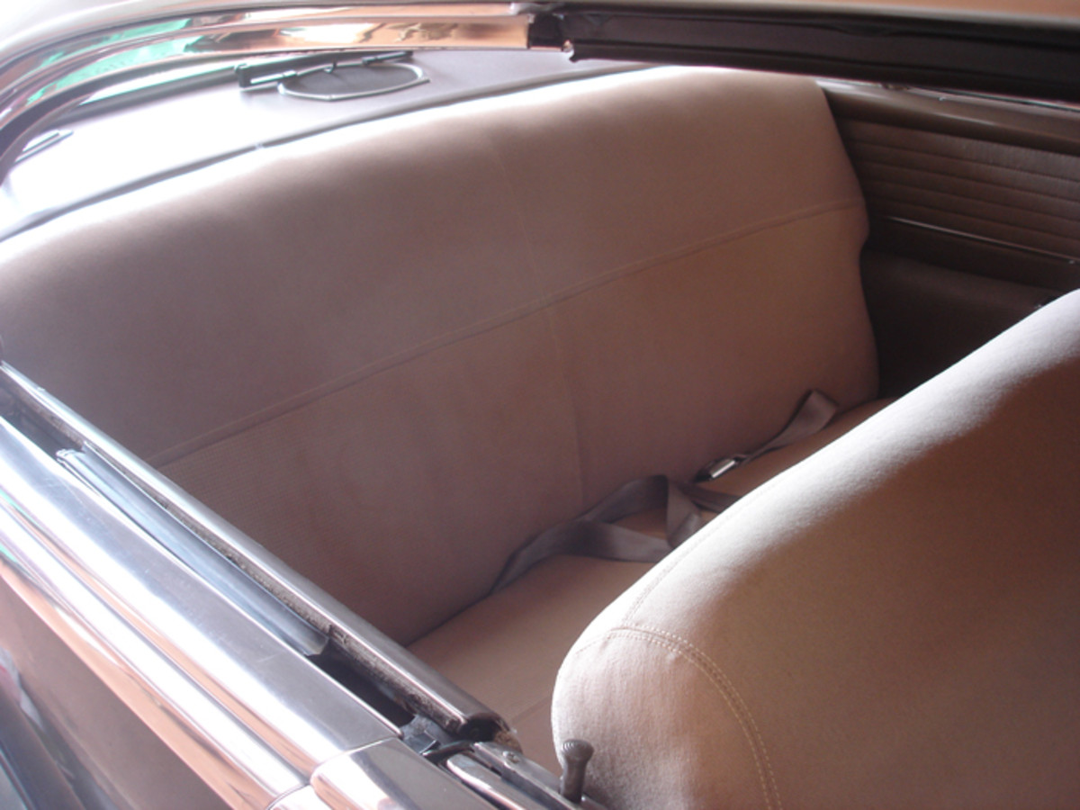 Note the seam between the fabric of the seat upholstery and the horizontal pleats in the side panels of the Series 61. This car’s optional rear speaker can be seen on the package shelf.
