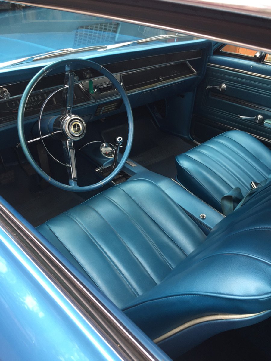 The covers on the bucket seats have been replaced, but the rest of the interior is original. Note the Chevrolet-installed shift handle and ball — most were replaced by Hurst components on day two. Hidden by the steering wheel is the “knee knocker” tach.