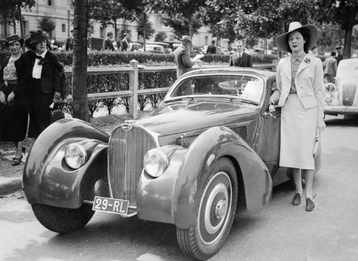 In 1937, Andre Bith had the Bugatti Type 51 Grand Prix chassis once raced by famous driver Louis Chiron fitted by Louis Dubos with a Bugatti Atlantic-type body. The car then appeared on rallys and the concours circuit. It is pictured here with Miss Lucette Joussy at a concours at Bois de Boulogne, France, in June 1938.