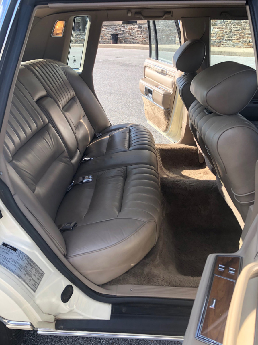 Lincoln knew an occasional Town Car owner was driven, so leg room is also a luxury for rear seat occupants who are additionally treated to a center fold-down armrest.