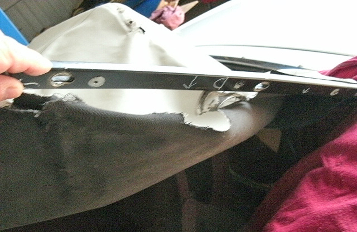This trim stick fastened the material that makes up the convertible top, rear curtain, rear pads, headliner and top well (the area behind the rear seat into which the top folds) to the rear of the body. When this “keystone” piece was removed, its orientation and the location of other top components that attach to it were marked.