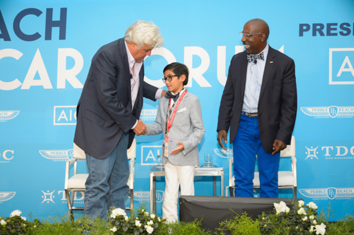  Jay Leno invites a young automotive enthusiast to join him and Donald Osborne on stage at the conclusion of their 2017 Pebble Beach Classic Car Forum. 