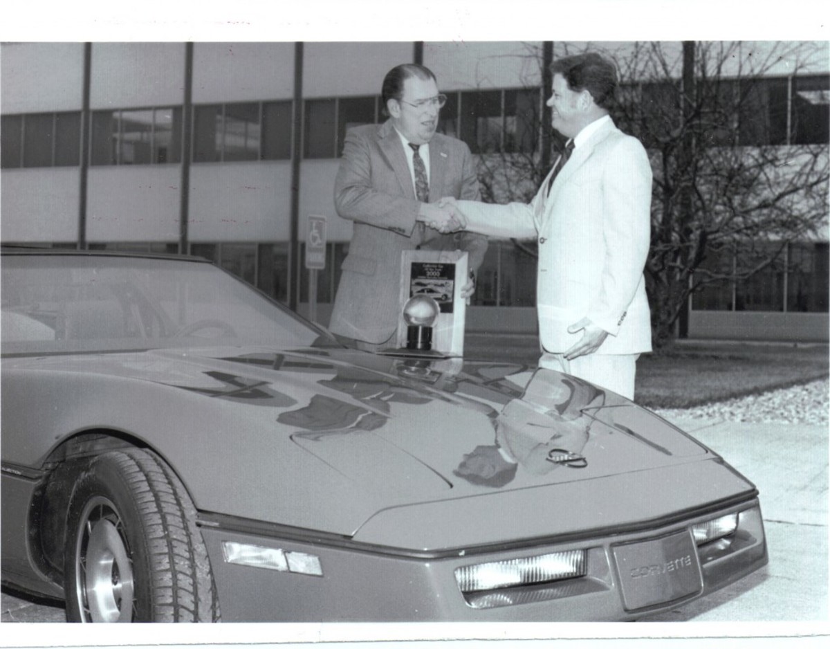 Tex Smith (at right) presenting an award for the new Corvette.
