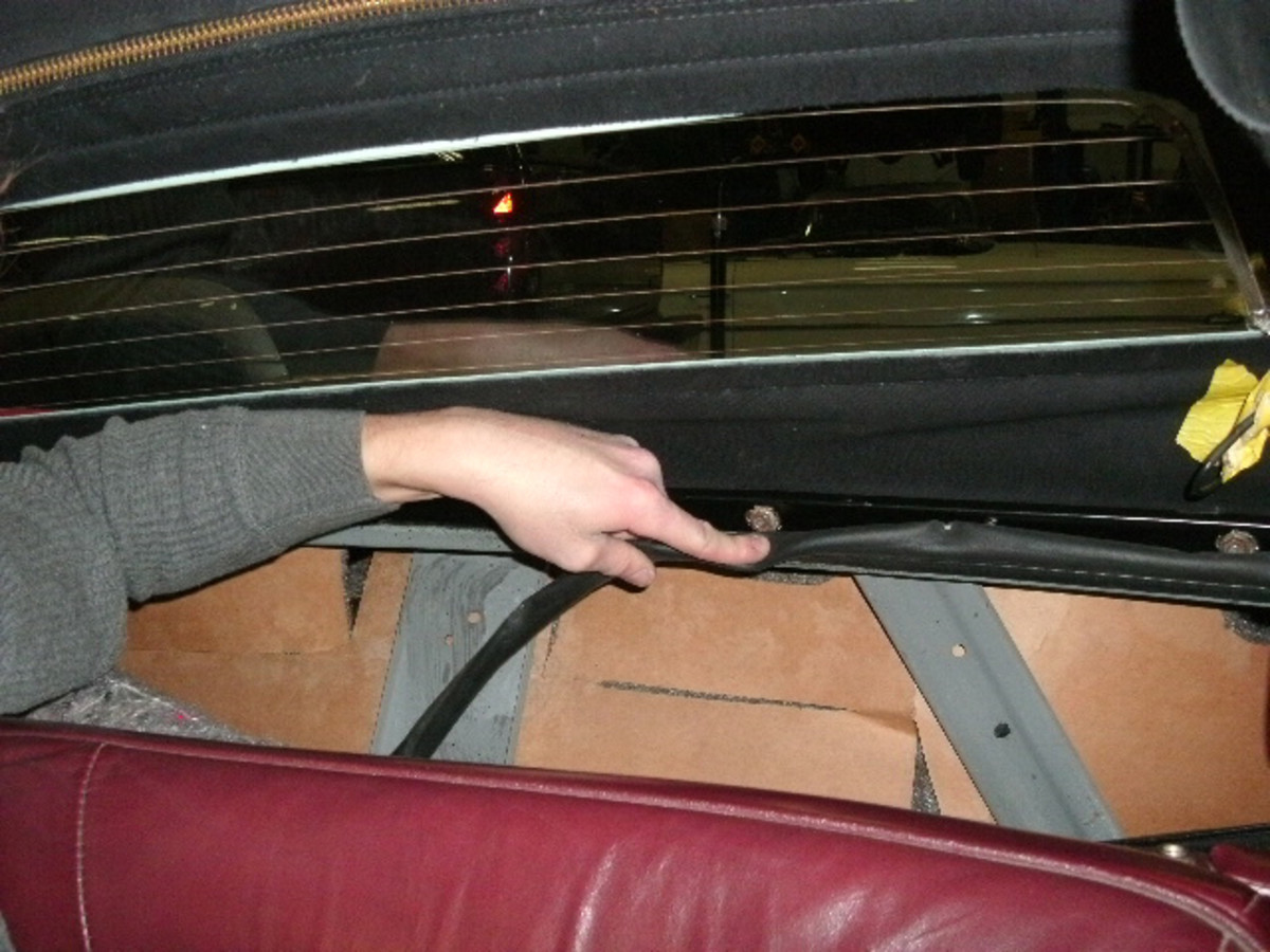 Here, Chase located the center to install the trim stick. Then, she adjusted the rear bow height to the factory specification and installed the rear curtain to the rear bow.
