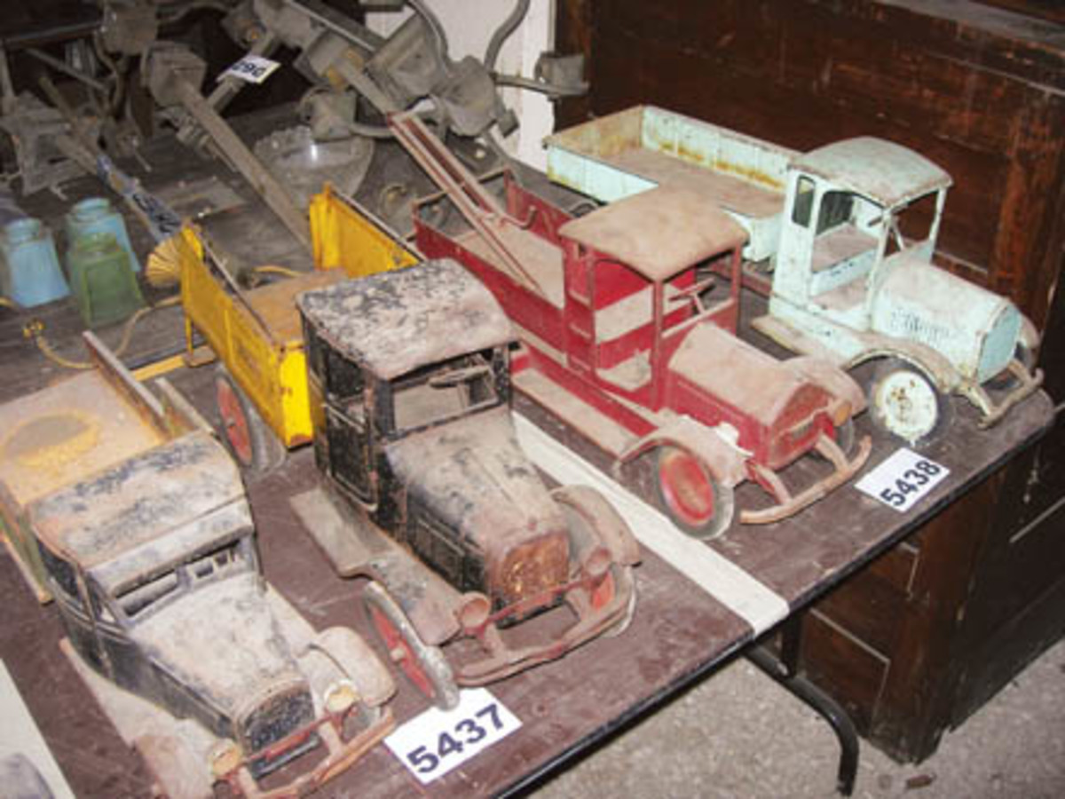 The Hartung Collection consisted of many pressed-steel Sturditoy trucks, including these (Lot 5438) dump and wrecker models. The pair sold for $1,600.