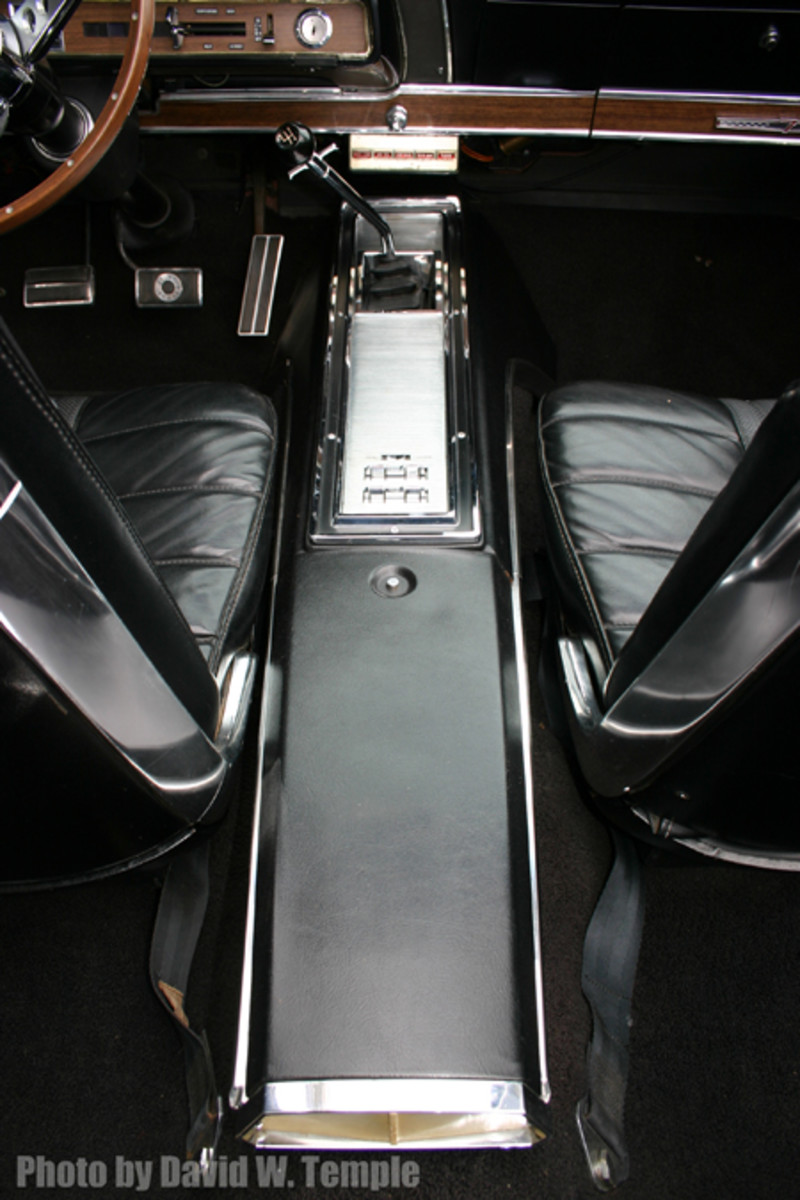  This console houses the switches for the optional power windows as well as the gear shifter.
