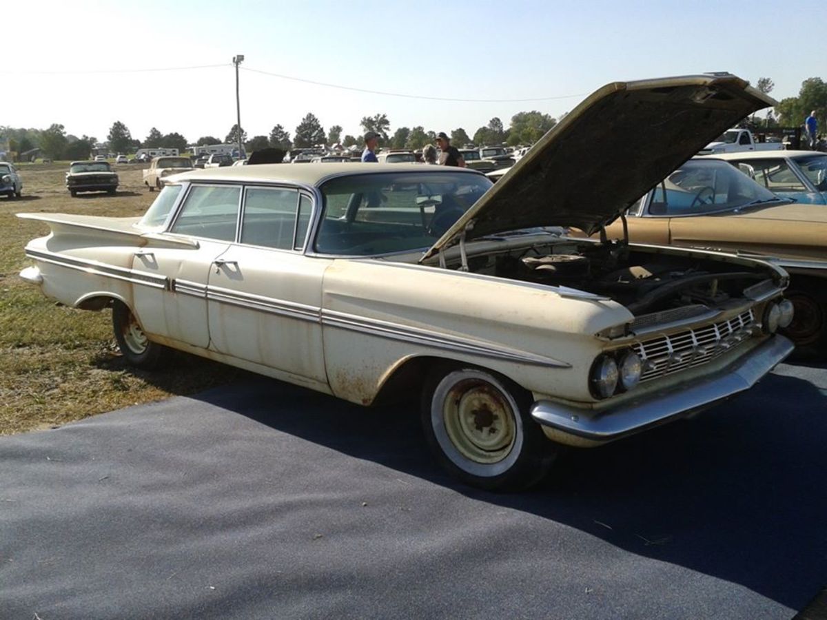 This 1959 Chevrolet Impala 4dr HT with 2 miles sold for $16,000 today in Pierce, Neb, by VanDerBrink Auctions.