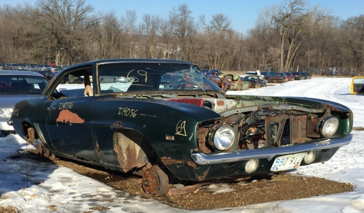 It's not a mirage, it's truly a 1969 Camaro in a salvage yard....in 2015. The interior is pretty bare and the drivetrain has been plucked, but there remains trim and other parts for the 1969 Camaro owner in search of hard-to-find bits.