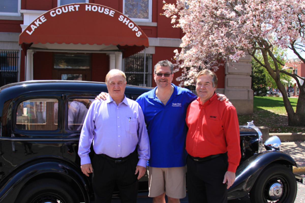 Sen. Rick Niemeyer, left, stands with Speros A. Batistatos, president and CEO of the South Shore CVA, and Roger Pace, the new owner of the 1933 Essex Terraplane 8, after the car’s auction on Saturday, May 2, in front of the Crown Point Courthouse.