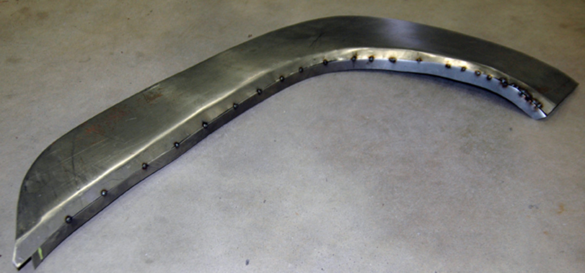  Now that the pieces are tack welded together, their seam can be fully welded and the weld then ground smooth.