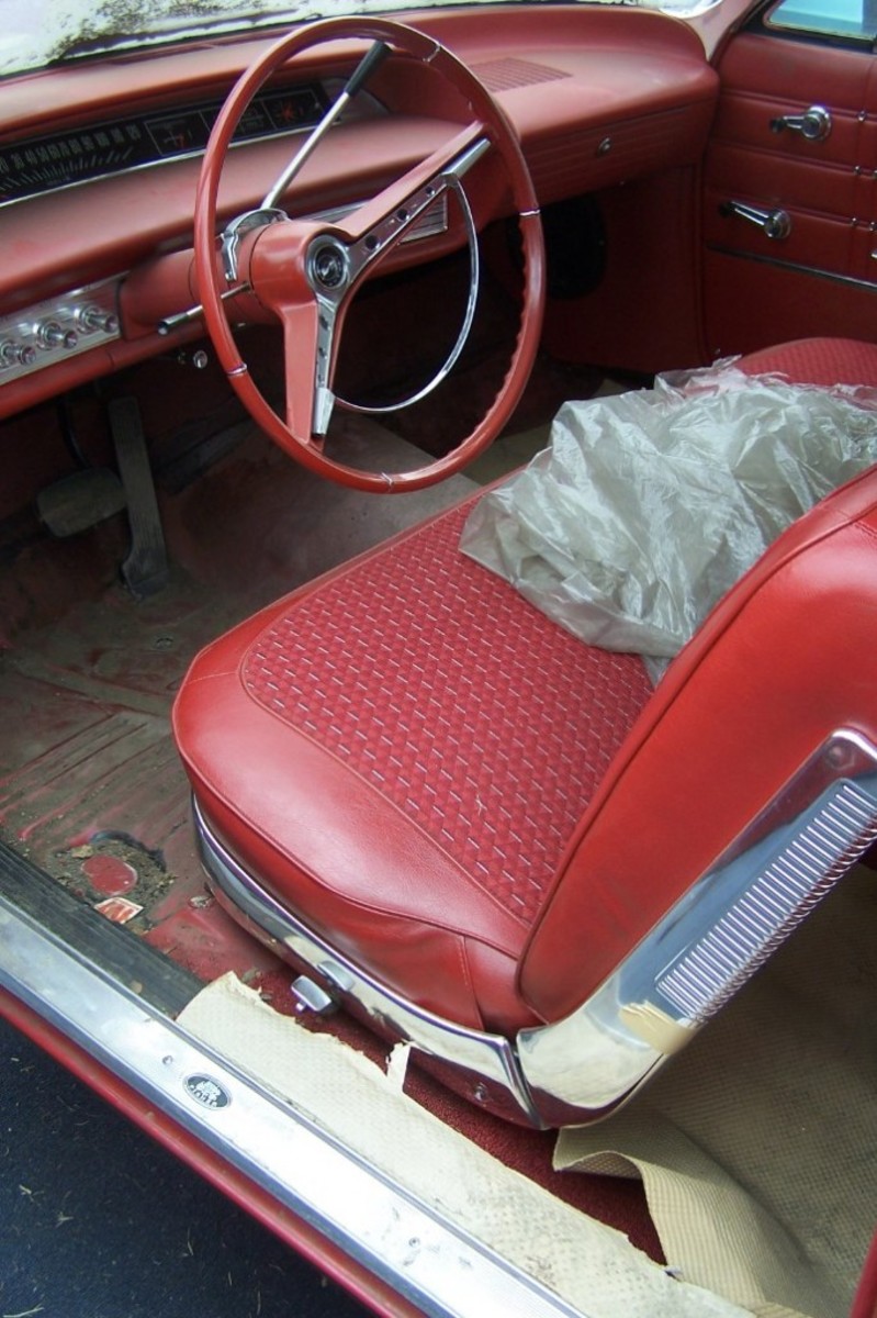 The interior of the 11-mile 1963 Impala while it was offered at the VanDerBrink Auctions sale of the Lambrecht collection. Note the shipping plastic remained on the front seat. Also, the front carpet was left in the trunk, which allowed it to remain in mint condition.