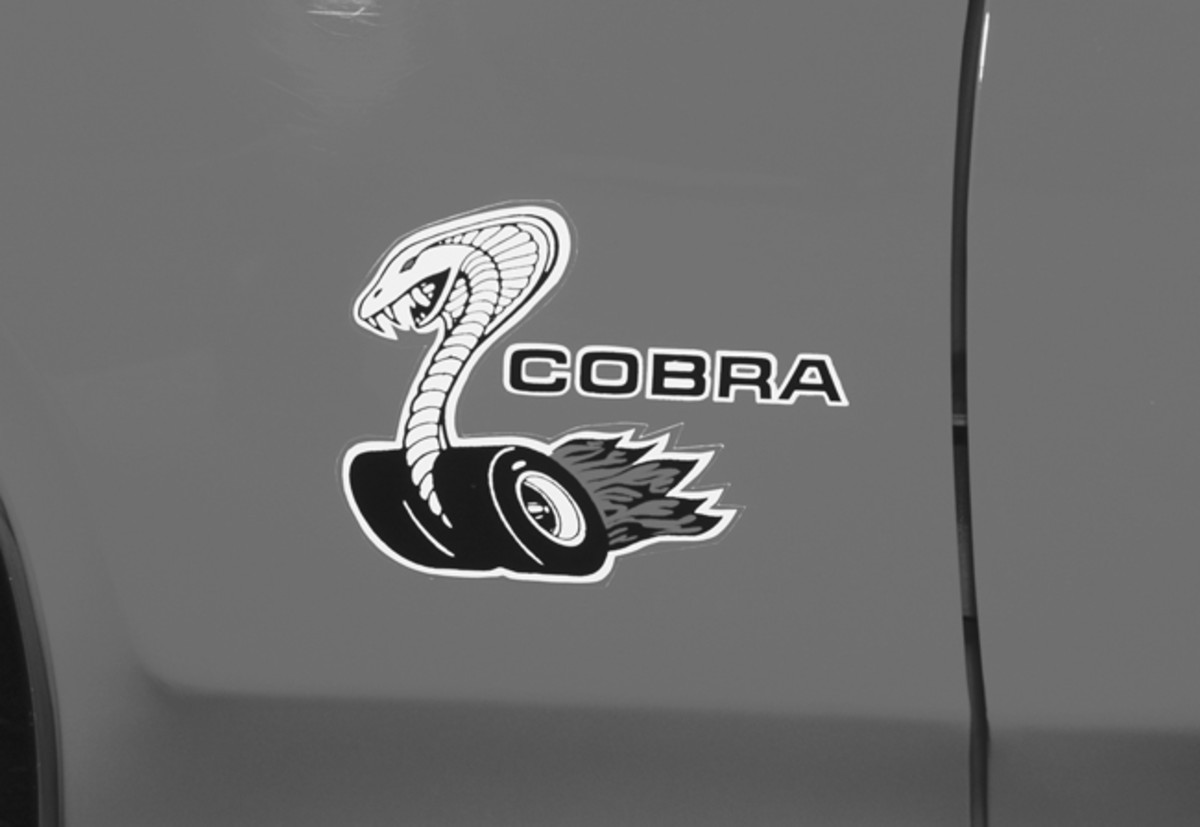 The large cartoon Cobras were replaced by smaller chrome emblems midway through the model run. This is a late-production car, however, so their presence is a mystery.