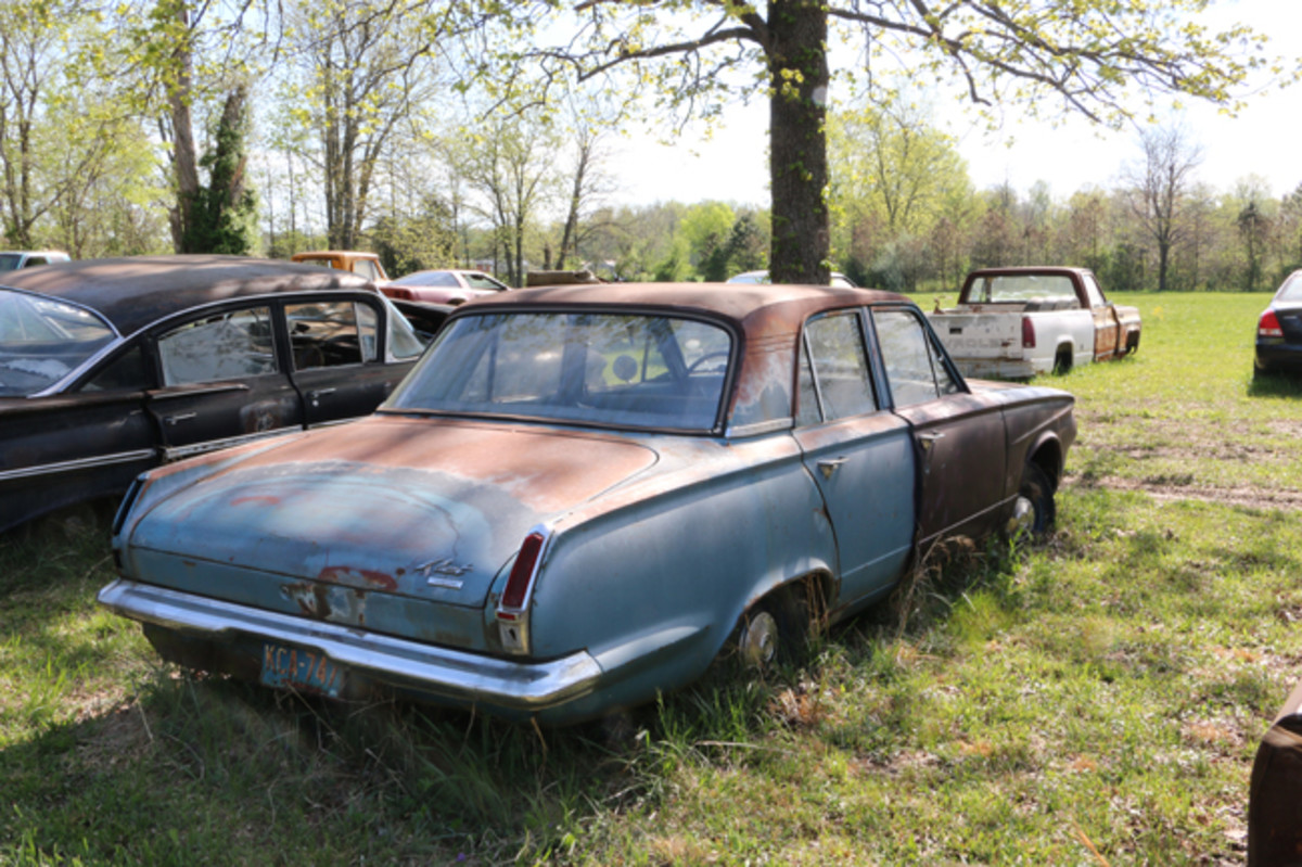 Lots of good parts, including the grille, remain on this 1964 Valiant sedan.