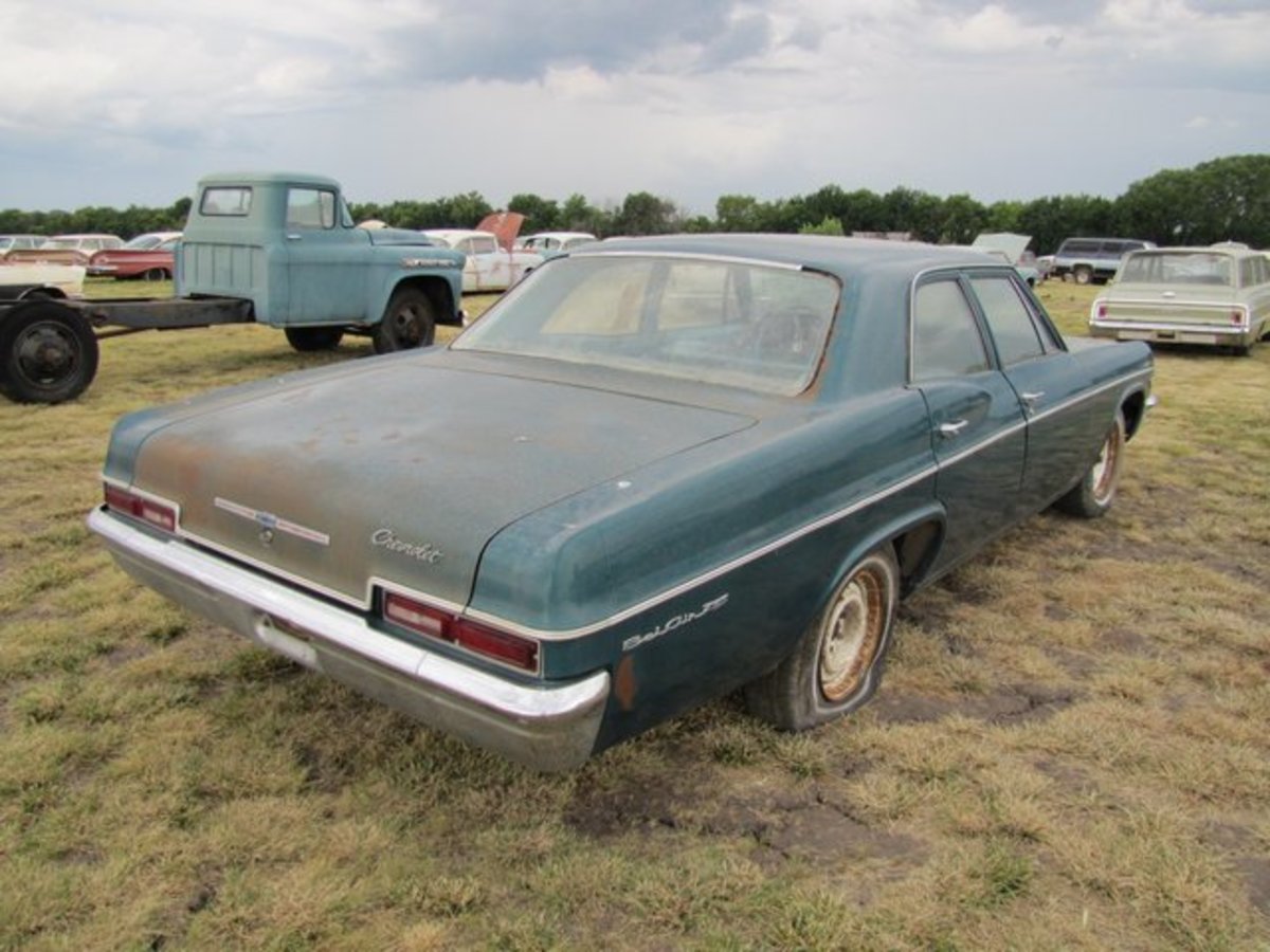 There are seven miles and a window sticker on this V-8-powered 1966 Bel Air sedan.