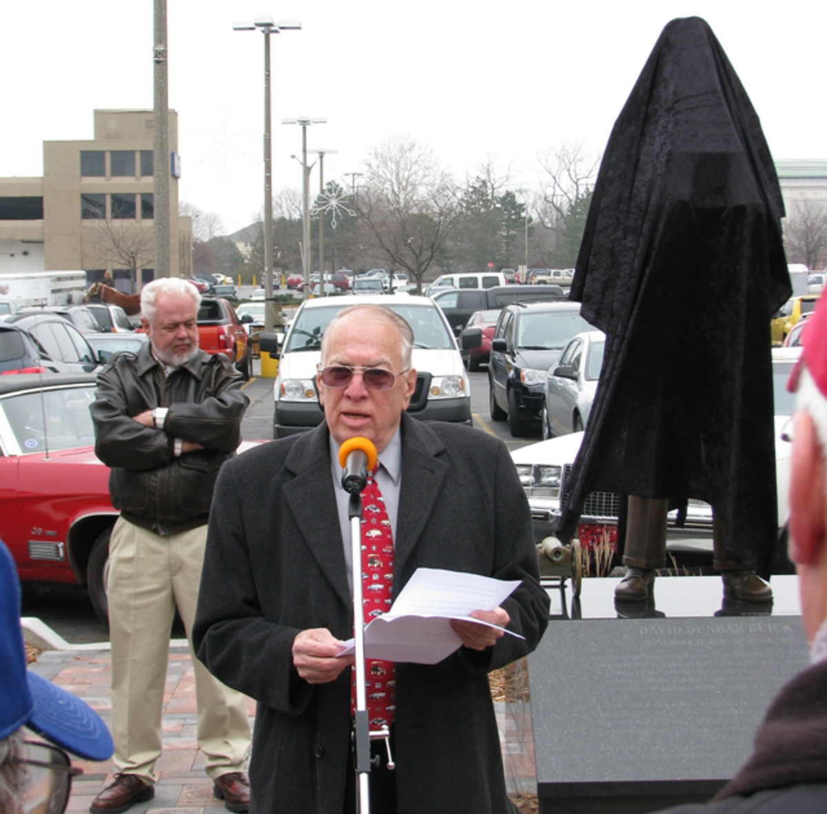 A speaker at the statue unveiling was Lawrence R. Gustin, a Flint native and retired Buick public relations assistant director, who wrote the first biography of Buick.