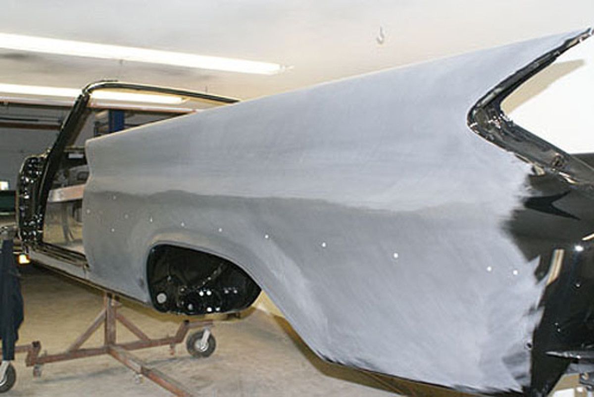  A second pass with 800-grit sandpaper is completed at an opposite angle in a method Kopecky calls “cross-cutting.” Each time Kopecky starts sanding a fender, he sands at an angle opposite to his previous pass.