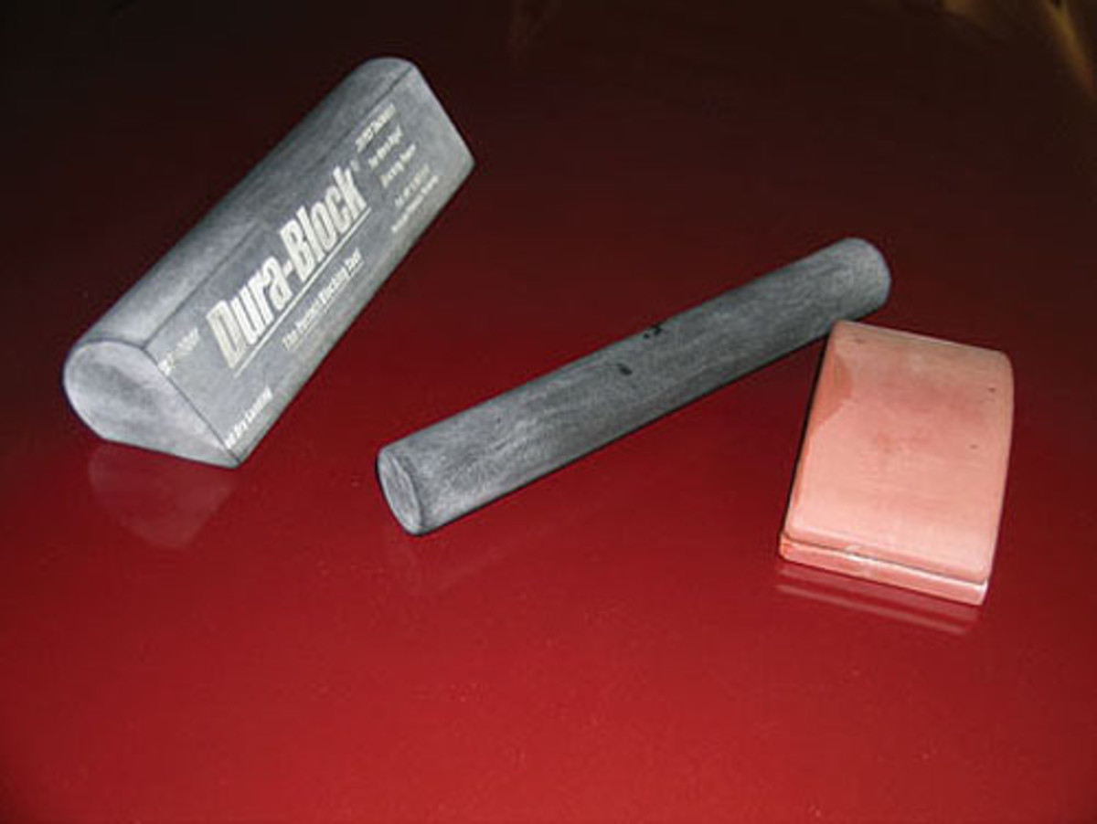  Rubber sanding blocks of different shapes and sizes are used on the varioussurfaces of the body.
