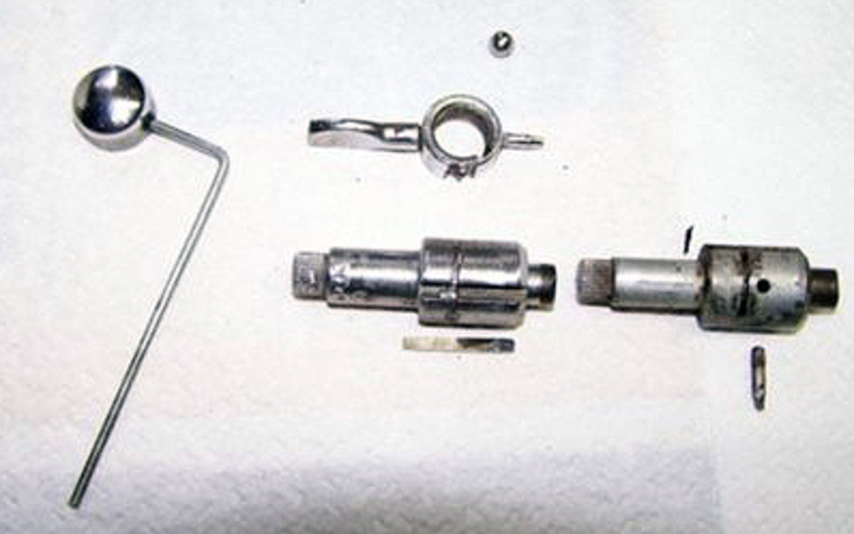 An exploded view of the disassembled ignition lock for a 1935-’36 Ford.