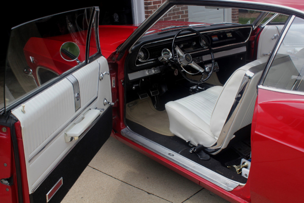 You have to look hard to find a flaw in this ’65 Impala SS. The column-mounted tach and under-dash eight-track tape player were add-ons, but the rest of the classy black-and-white interior looks almost new after 29,000 miles and 55 years.