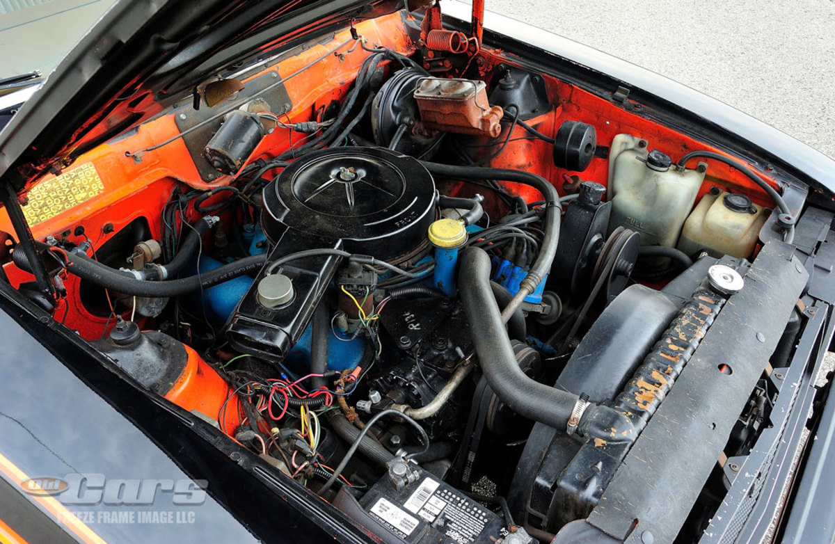 The prototype AMX is powered by the optional 304-cid V-8 with a four-speed transmission. The car was originally orange, and that paint can still be seen inside the engine compartment.