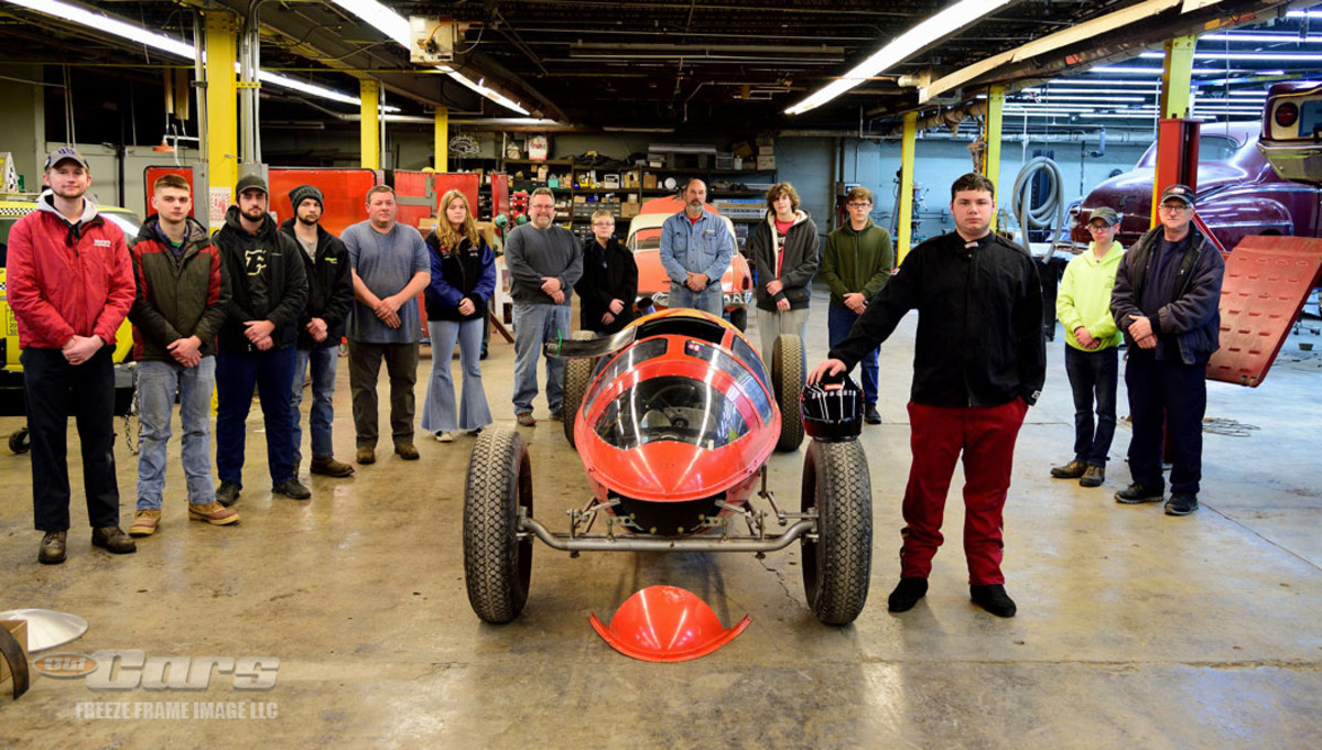 16-year-old Kaden Goebel (foreground) will be one of two people to pilot the belly tanker at the 2023 Bonneville Salt Flats World of Speed race in 2023. He is joined in this Jan. 23 image at the NATMUS Garage by several of the Youth Volunteers.