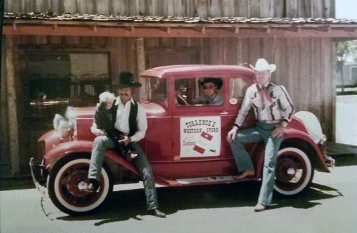 Left - Bob Tallman (PRCA Hall of Fame Rodeo announcer), my son Braeden, me (in the car) and my dad on the right.