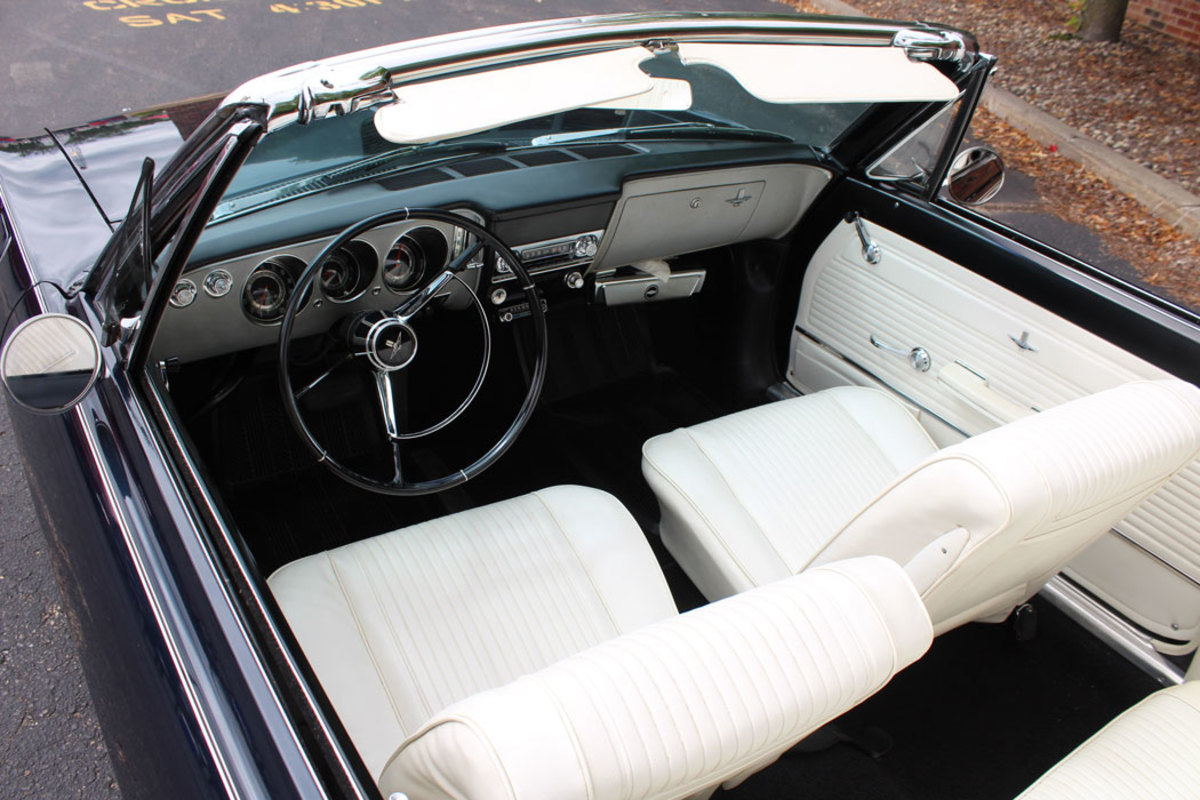 The Corvair's interior is white and black which gives it a formal look that accentuates the sporty lines of the car.