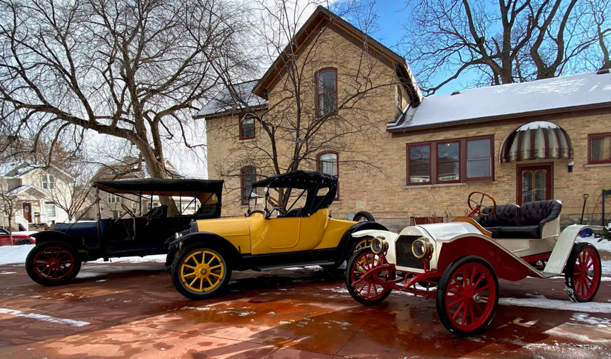 Pictures of these three cars — a 1913 White (left), a yellow 1915 Overland (center) and a 1909 Hupmobile (right) — have hung in James Steinberg’s bedroom since he was two years old. Now they’re parked in his garage.