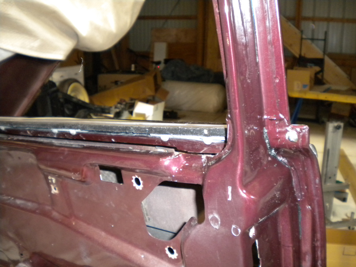 A portion of a door frame after cleaning and ready for weatherstrip installation.