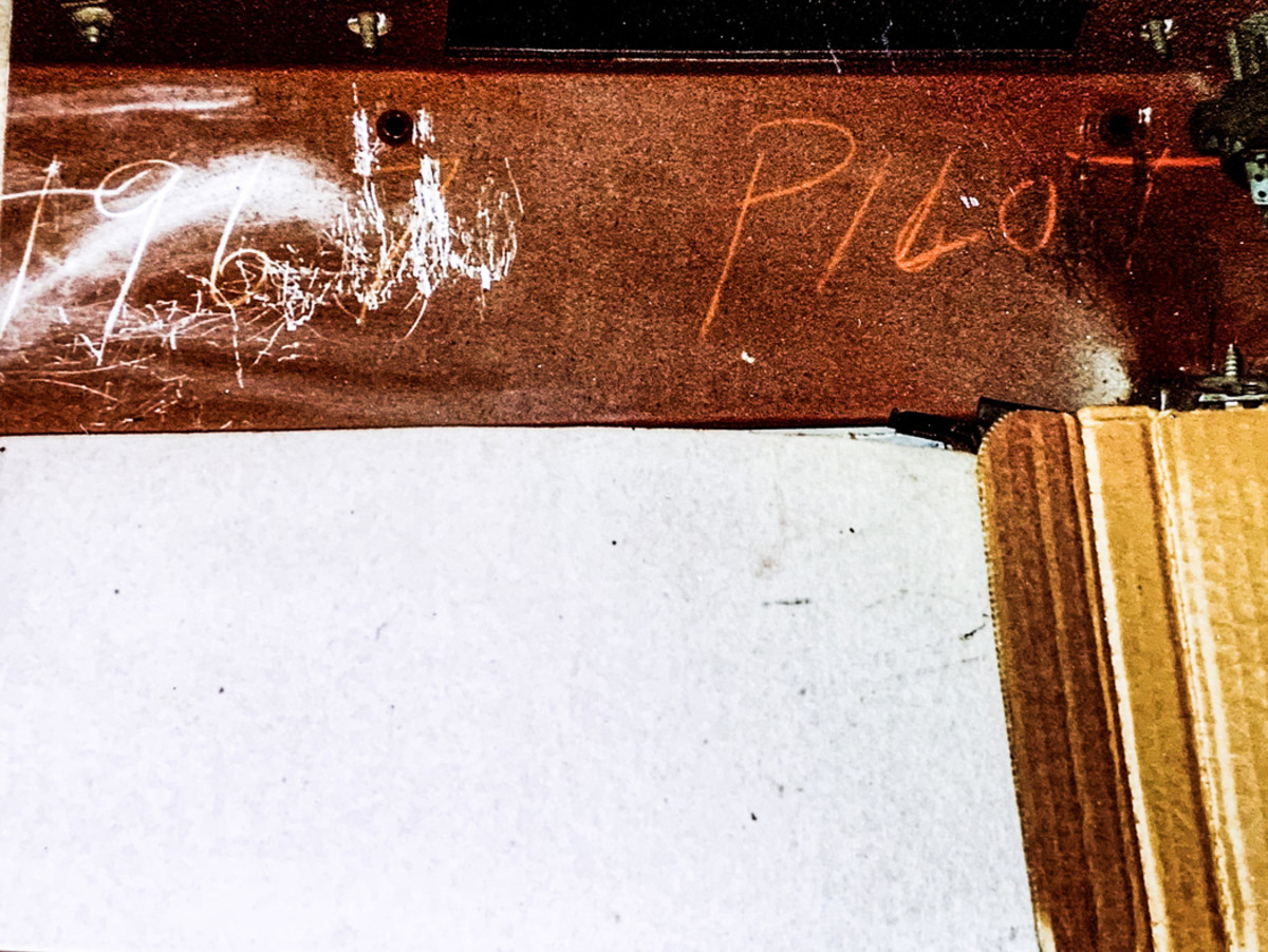 On the interior side, beneath the instrument panel, Olsen discovered assembly plant chalk scrawling of the word “Pilot.”