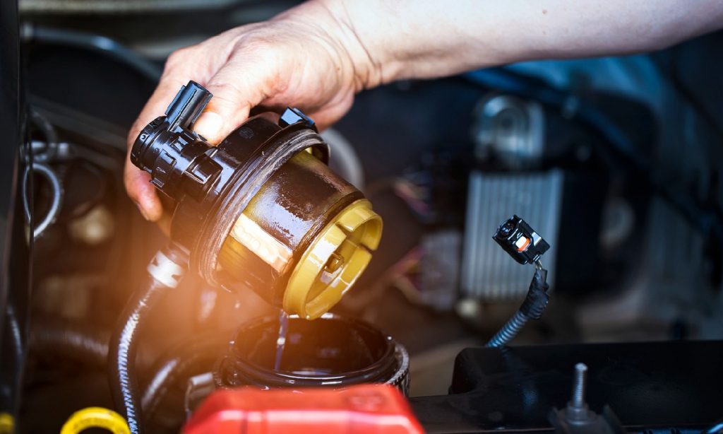 How To Change Your Car’s Oil Even if You Aren’t a Pro with an oil filter wrench