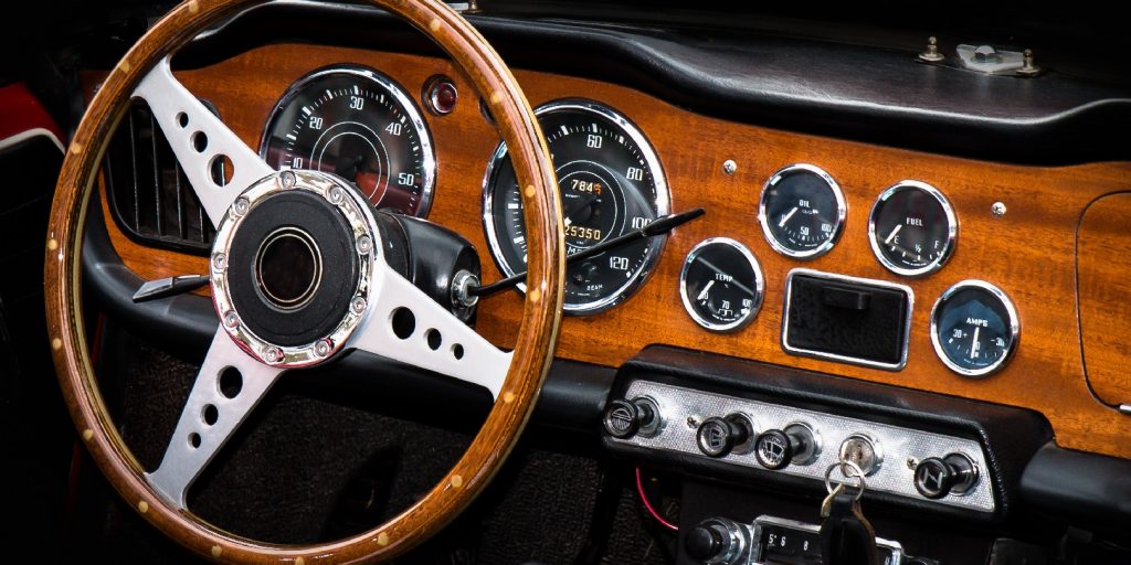 Classic wooden dash board on 60's Triumph Sports car